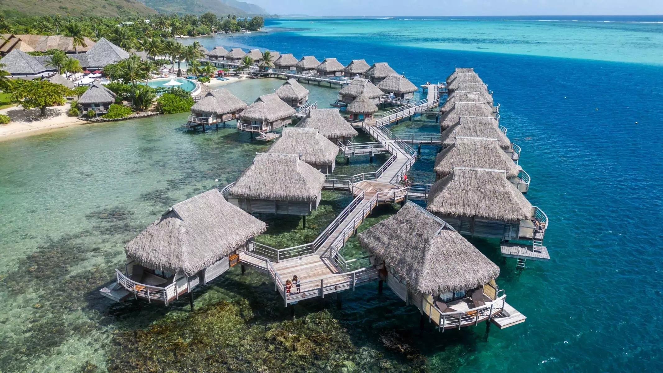 Overwater bungalow at dawn — your Moorea escape awaits